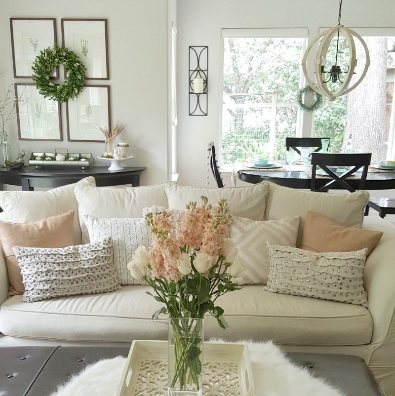 Neutral decor can still be wow. We love to add fresh flowers to keep even a casual room feeling elegant.