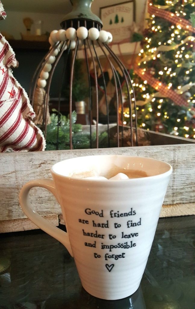 rustic metal and wood decor creates a cozy traditional christmas theme