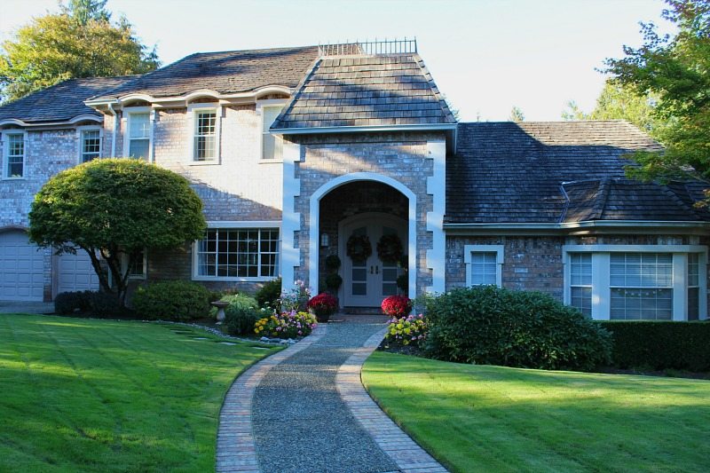French Classic Brick Home with gorgeous walkway and curb appeal
