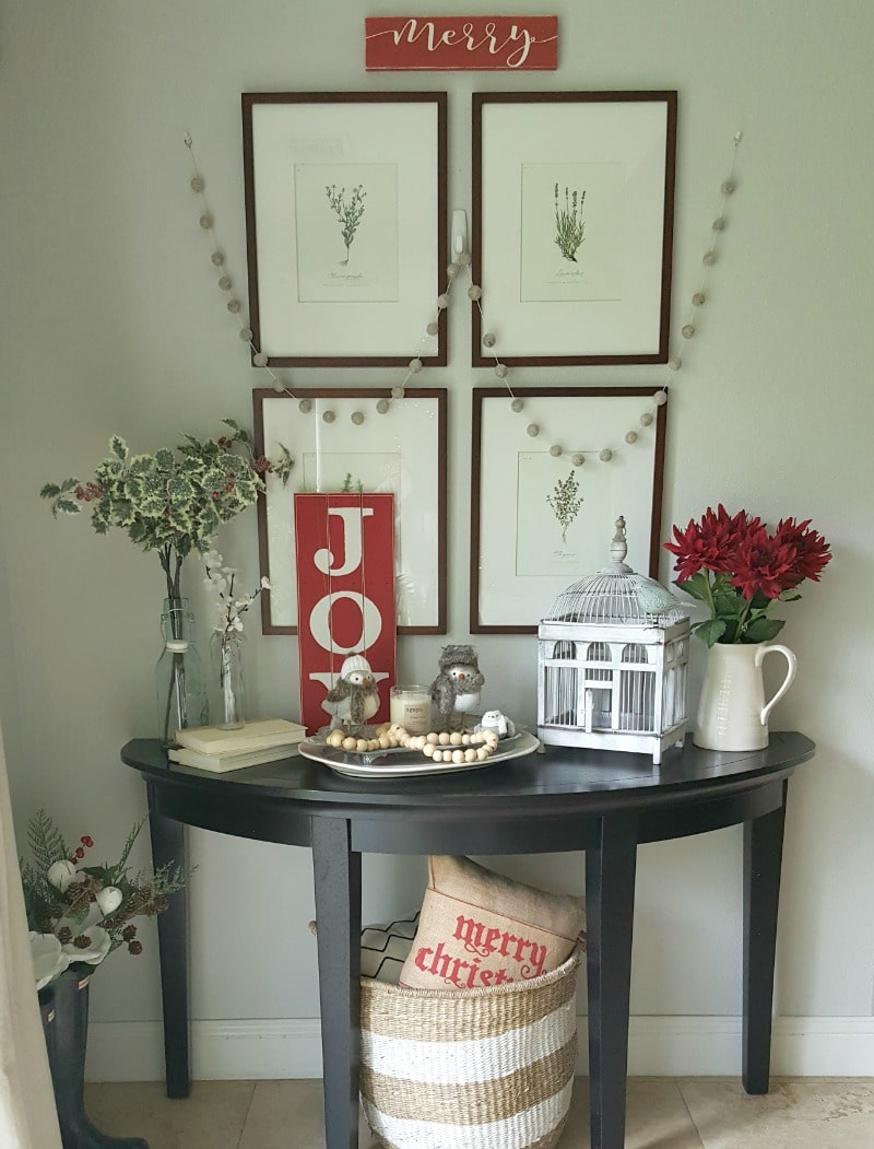 Holiday vignette with felt ball garland and pops of red