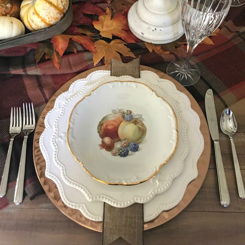 thanksgiving table with white chargers
