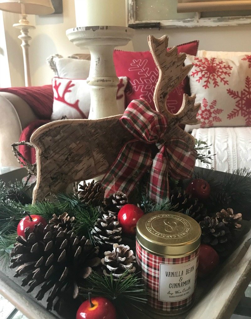 Create Christmas Magic in the living area with candles and deer