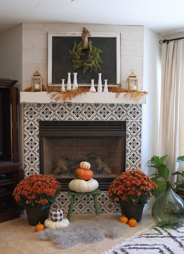 fall decorated tiled fireplace