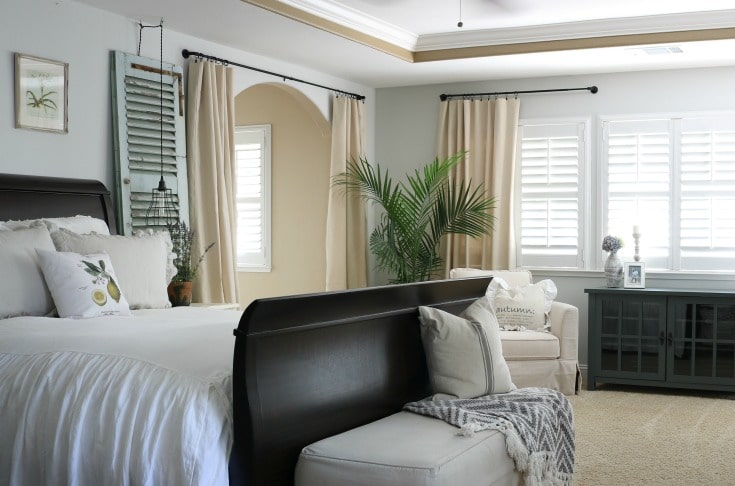 neutral palette and inexpensive furniture create relaxed and inviting master bedroom