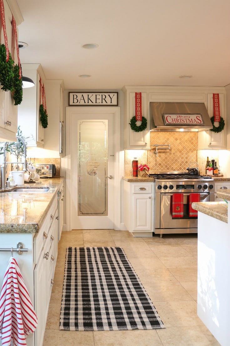 white farmhouse kitchen with holiday wreaths