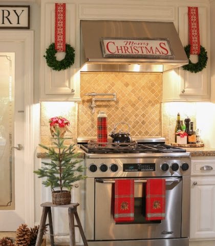Holiday Kitchen decorated with pops of red mini Christmas trees and festive mini wreaths