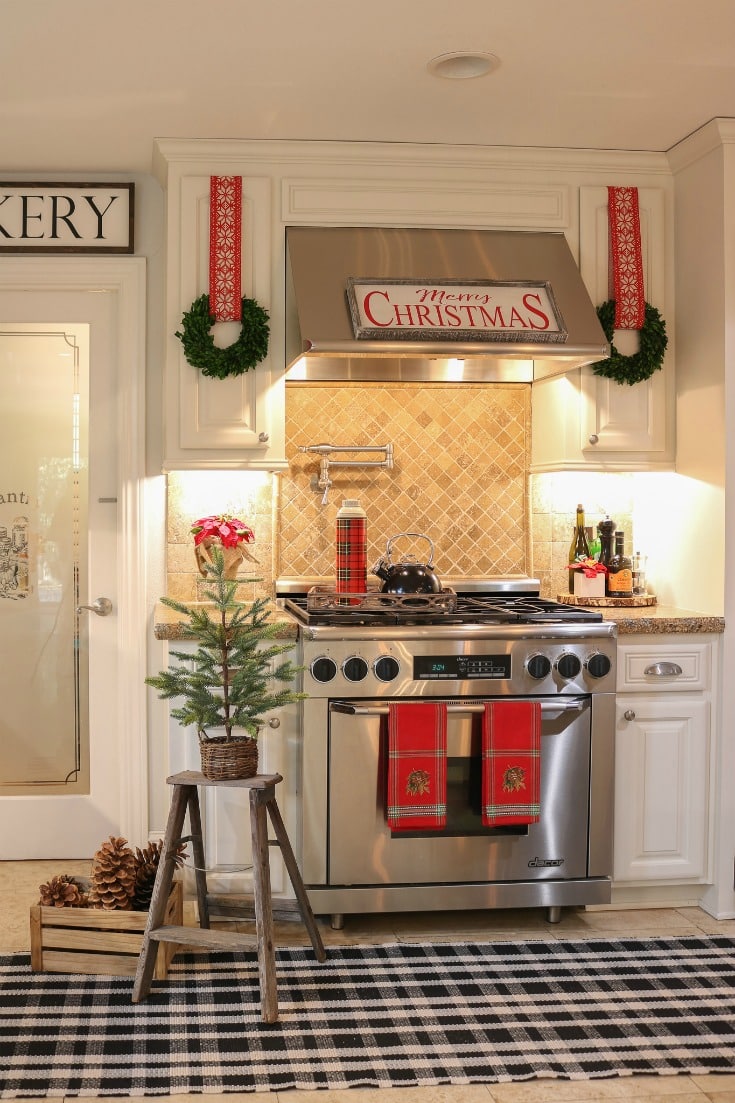 kitchen cabinet wreaths in white farmhouse kitchen