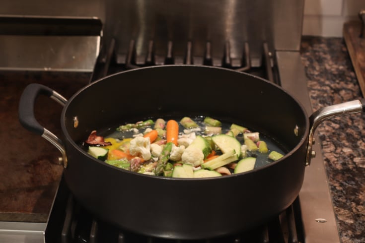 vegetables cooking in cast iron skillet to eat healthy