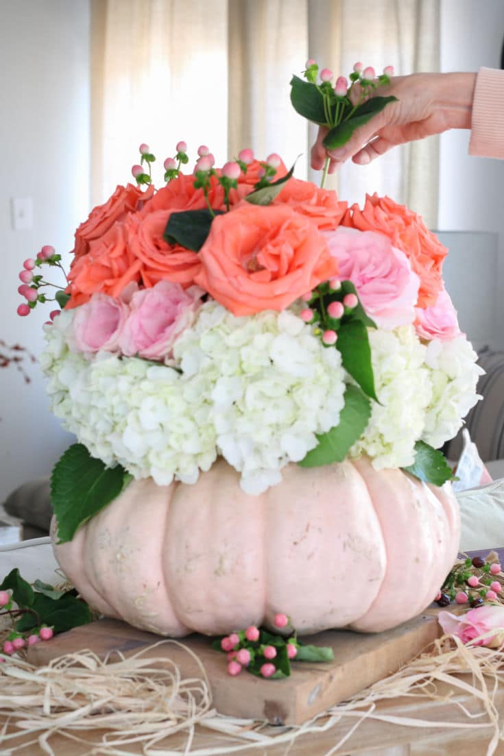 dramatic floral bouquet inside a pumpkin