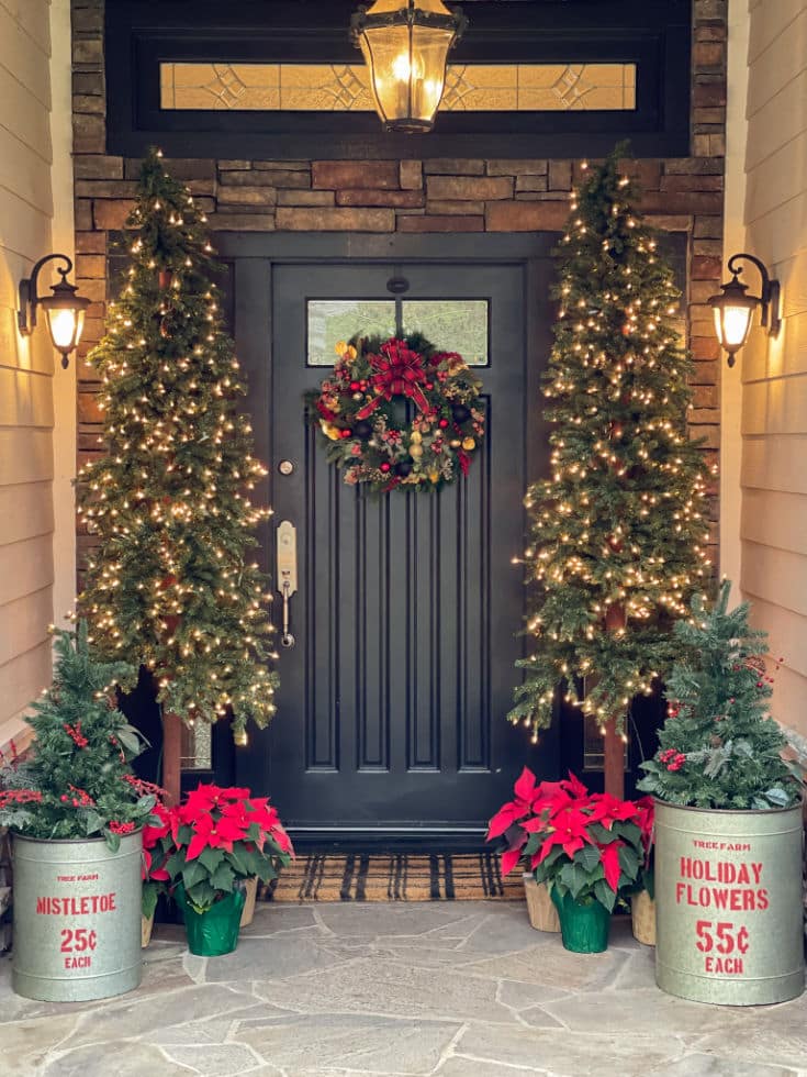 Front porch decor for Christmas is easy with Christmas trees and poinsettias