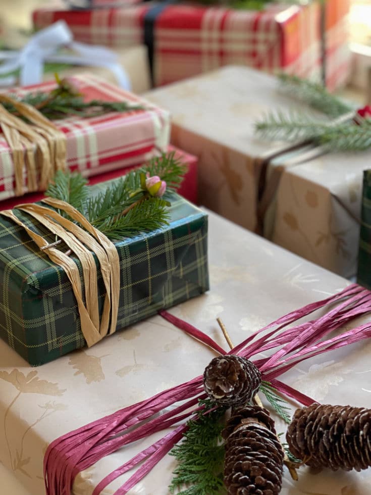 Pinecones and natural evergreen add pretty detail to Christmas wrapping