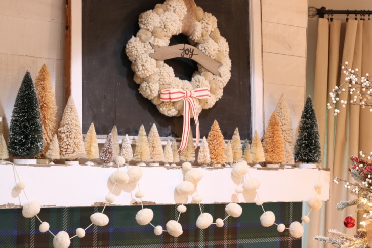 simple Christmas mantel decorated with vintage Christmas bottlebrush trees