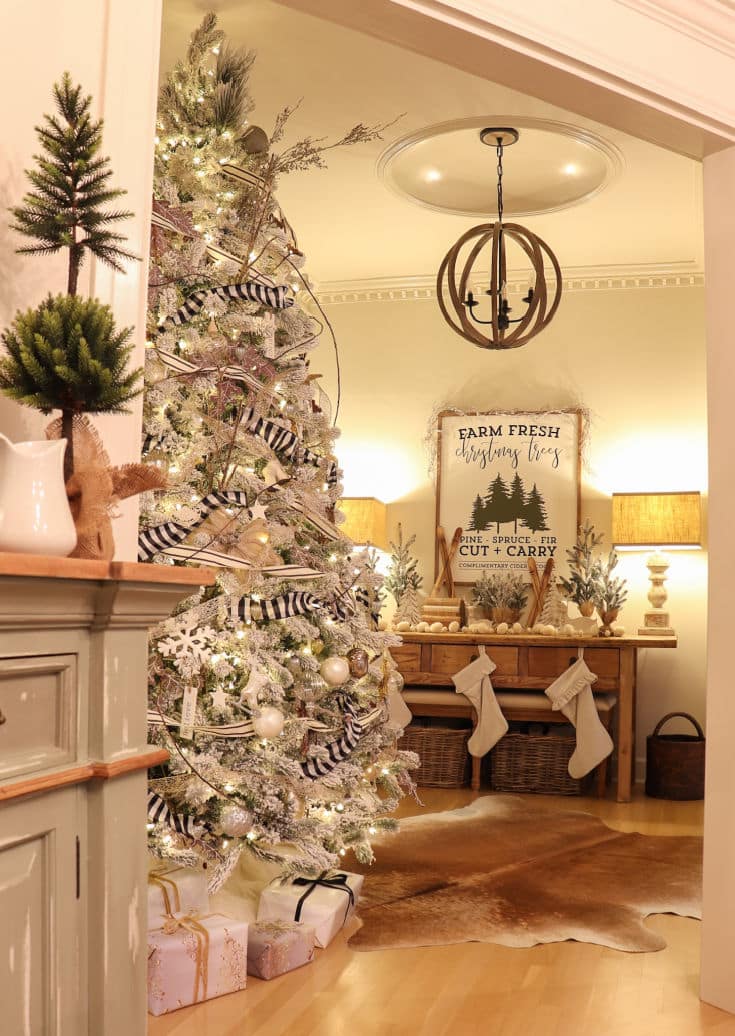 Artificial tree is beautiful and festive with white and black striped ribbons