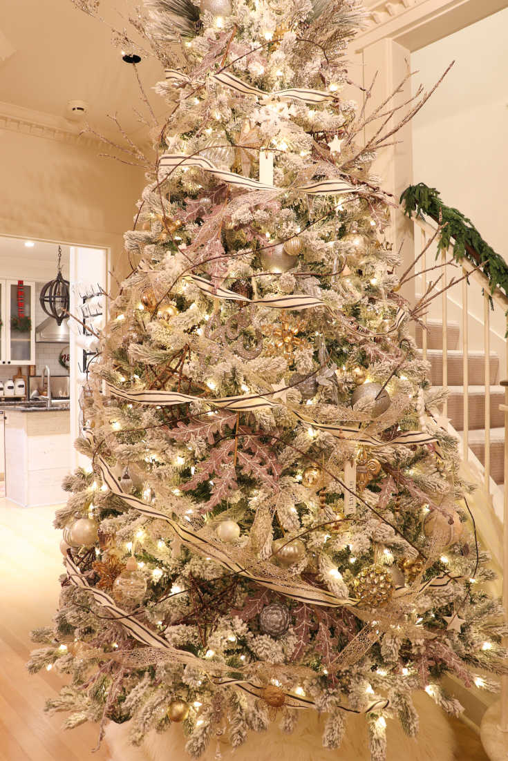 flocked Christmas tree with ribbon and bows is elegant