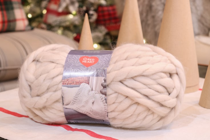 extra this yarn in off white color and cones is supply for mini tree project