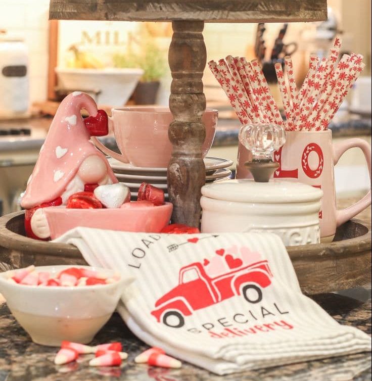 two tiered tray holds useful kitchen items on kitchen island