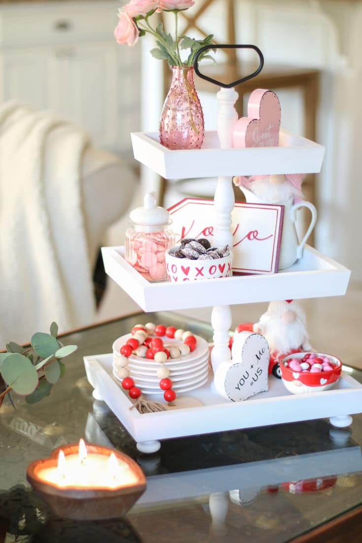 White wood tiered tray decorate for Valentines day with pink, red and white decor