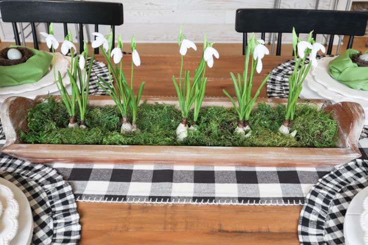 black and white table linens and faux florals create simple Easter decorations