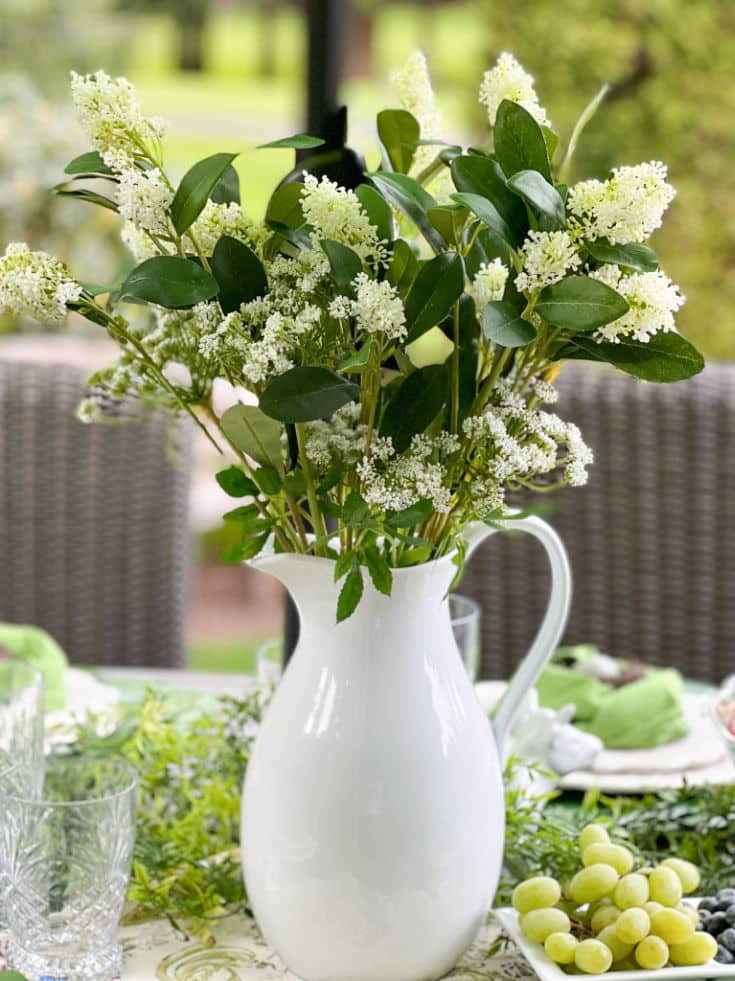 beautiful white ceramic vase and floral arrangement is the perfect decoration for the perfect celebration