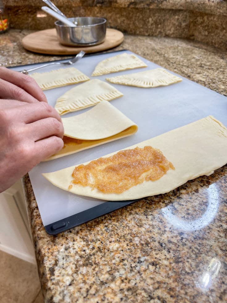 folding over refrigerator pie crusts to make easy homemade pop tarts