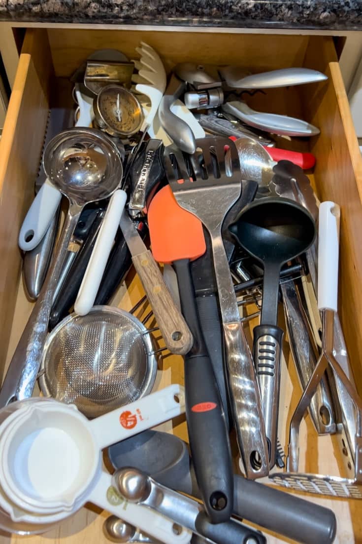 Before photo of utility drawer in total chaotic state.