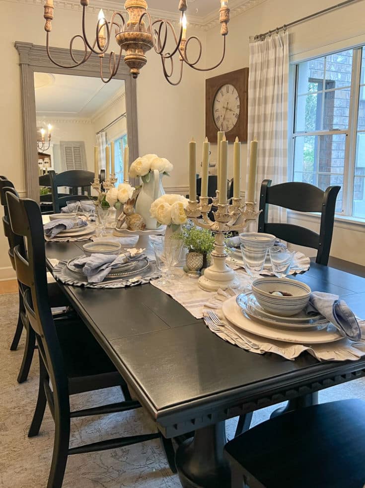 Easter table is set with linens and dishes in soft blue palette for spring